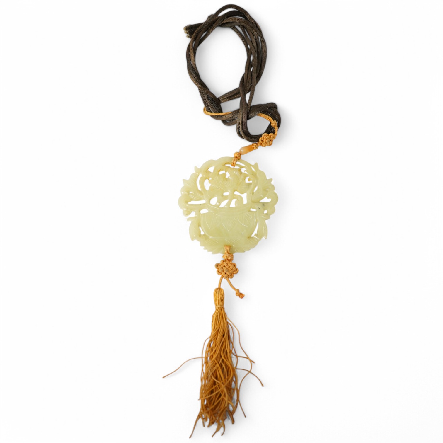 A Chinese pale celadon jade 'basket of flowers' pendant plaque, 19th century, 6cm wide. Condition - good